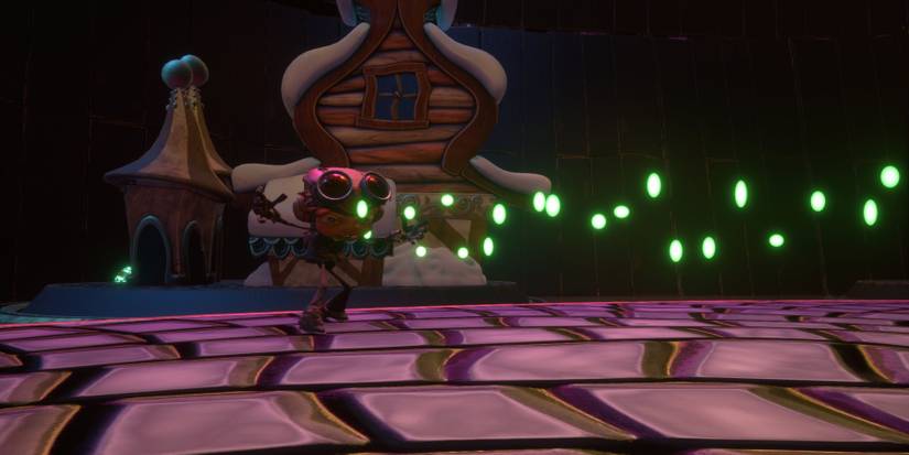 A young boy concentrating with green flecks of light appearing in a line in front of him