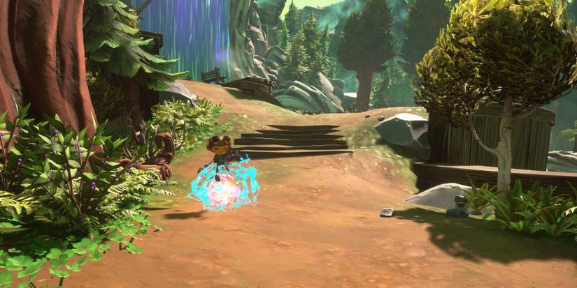 Raz rolling on a glowing, blue orb down a wooded slope