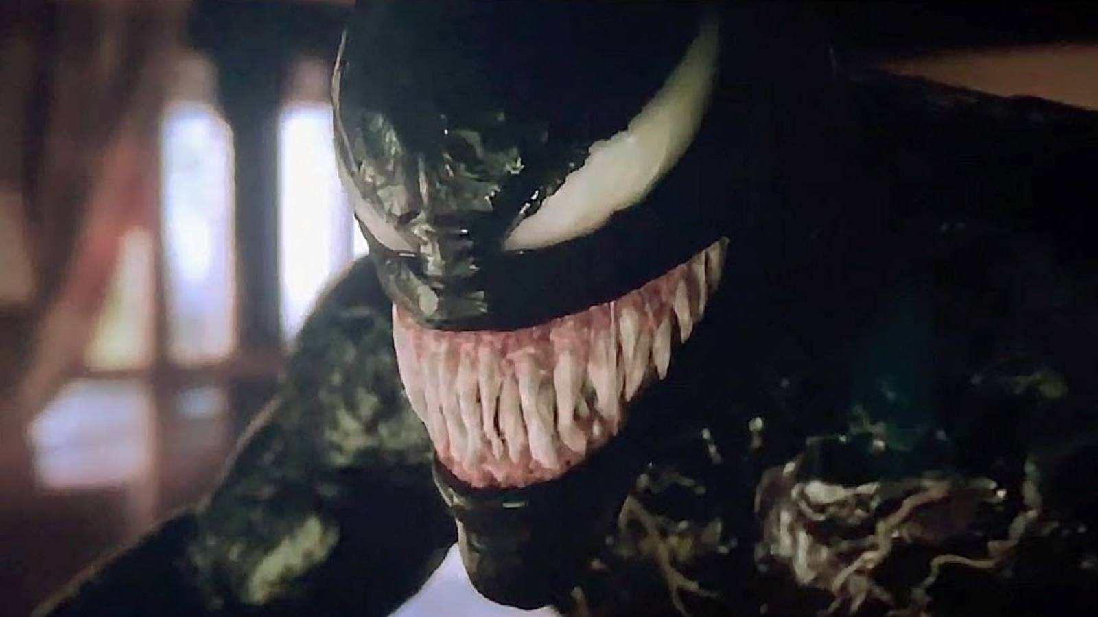 Venom grinning and baring his teeth in the post-credits scene for Venom: Let There Be Carnage