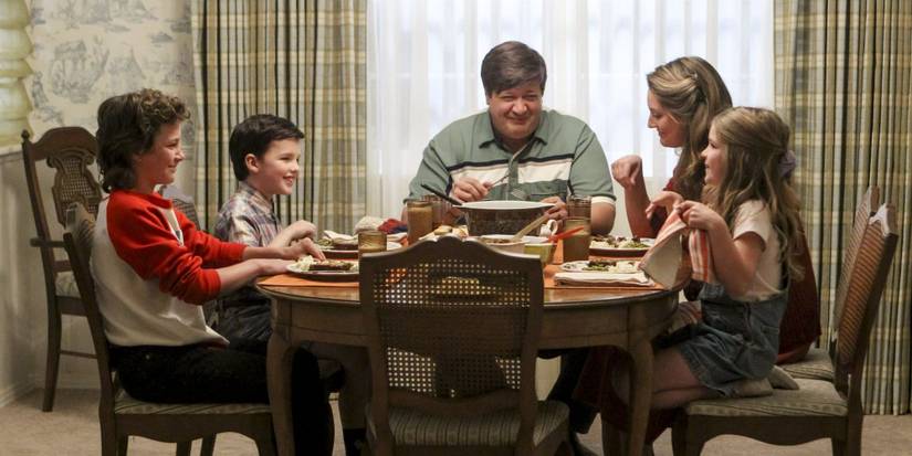 Young Sheldon having dinner with his family
