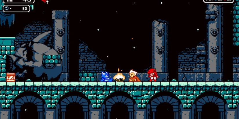 Screenshot of multiple characters gathered around campfire in Astalon: Tears of the Earth.