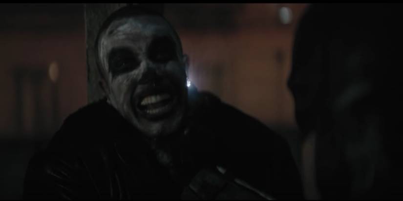 batman tasing a bad guy