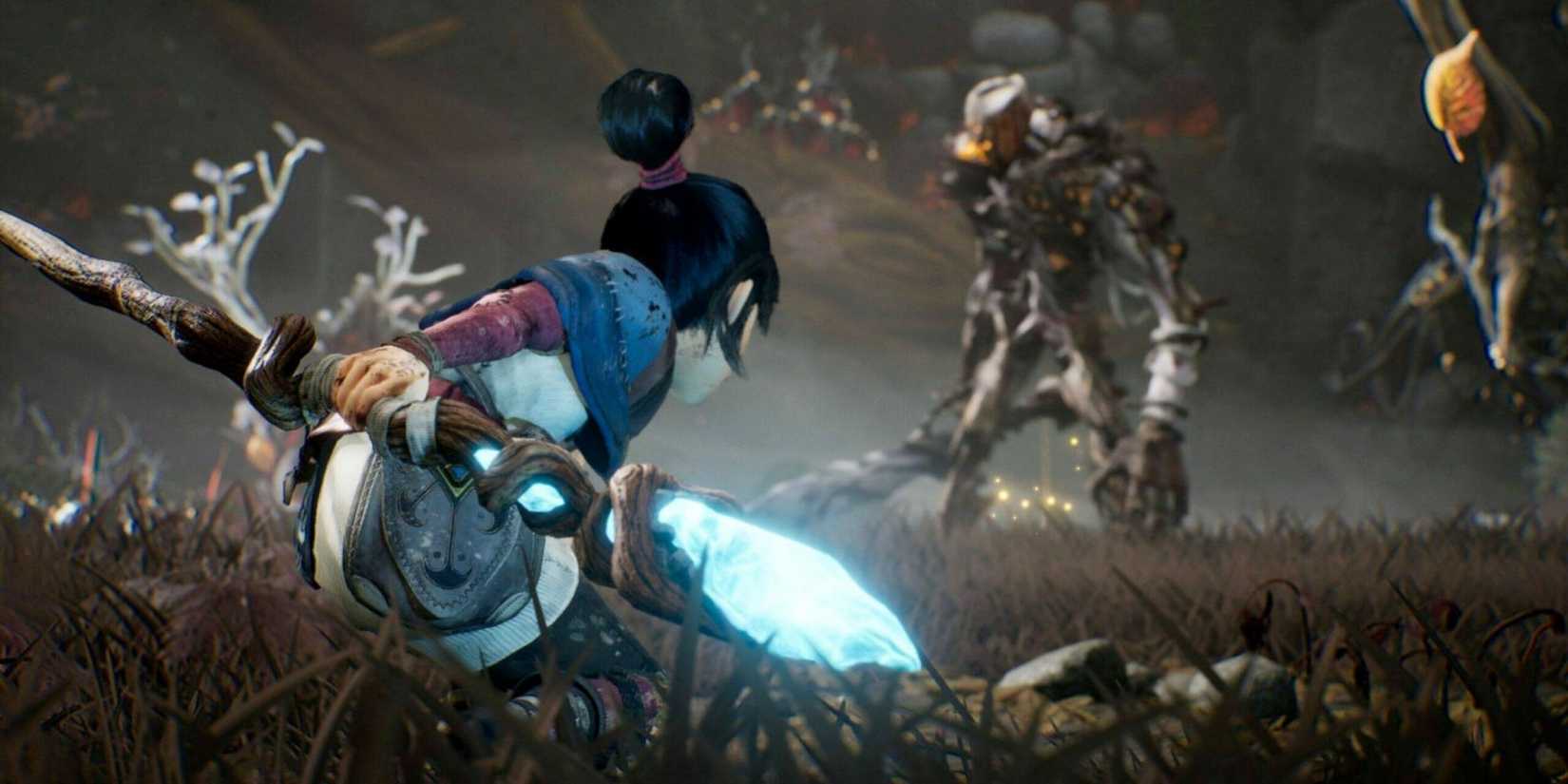 Screenshot of Kena from Kena: Bridge of Spirits in combat against multiple enemies.