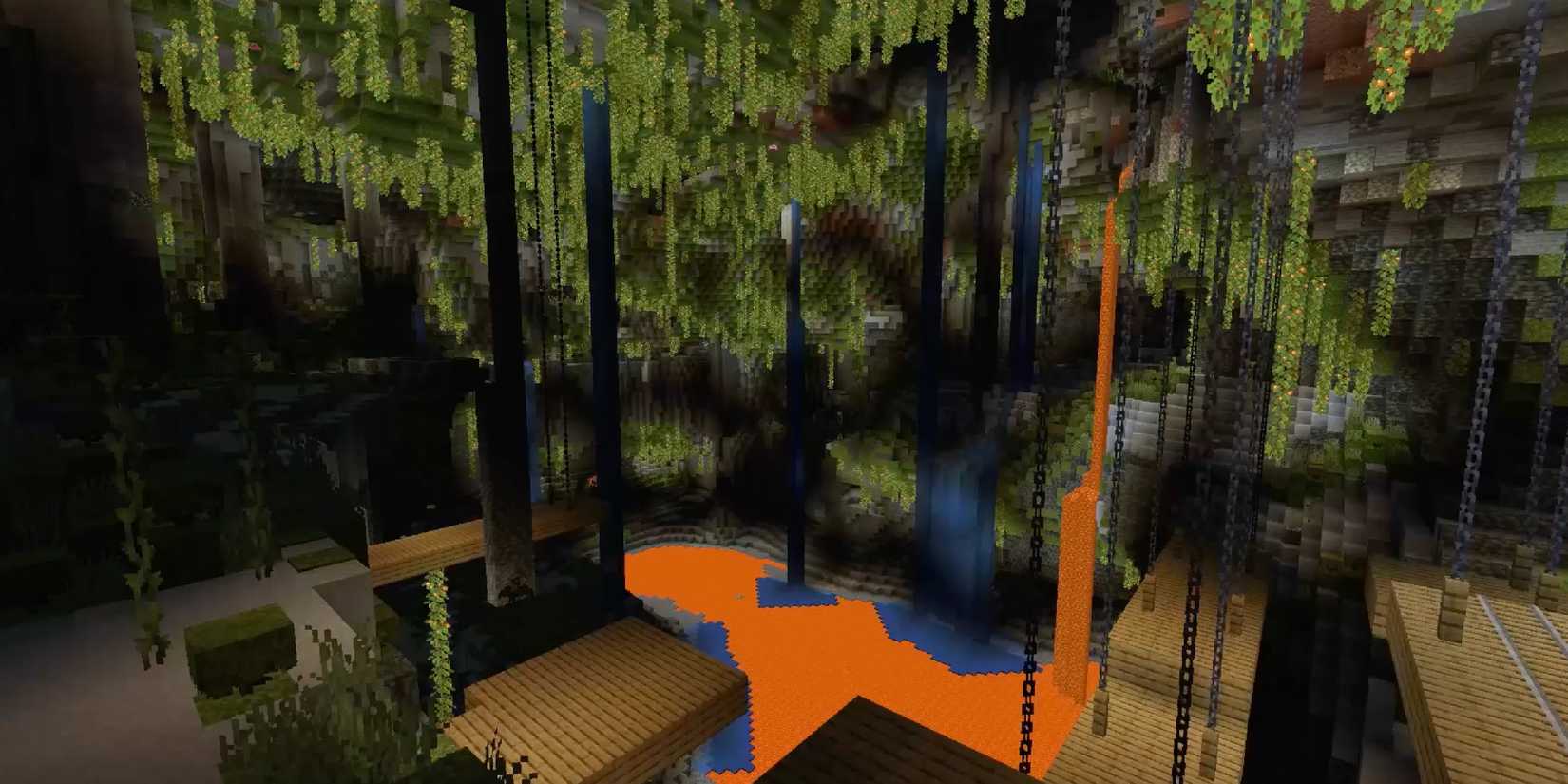 Minecraft screenshot showing a cave overgrown with vines. Abandoned mineshafts stretch out across a lava lake.