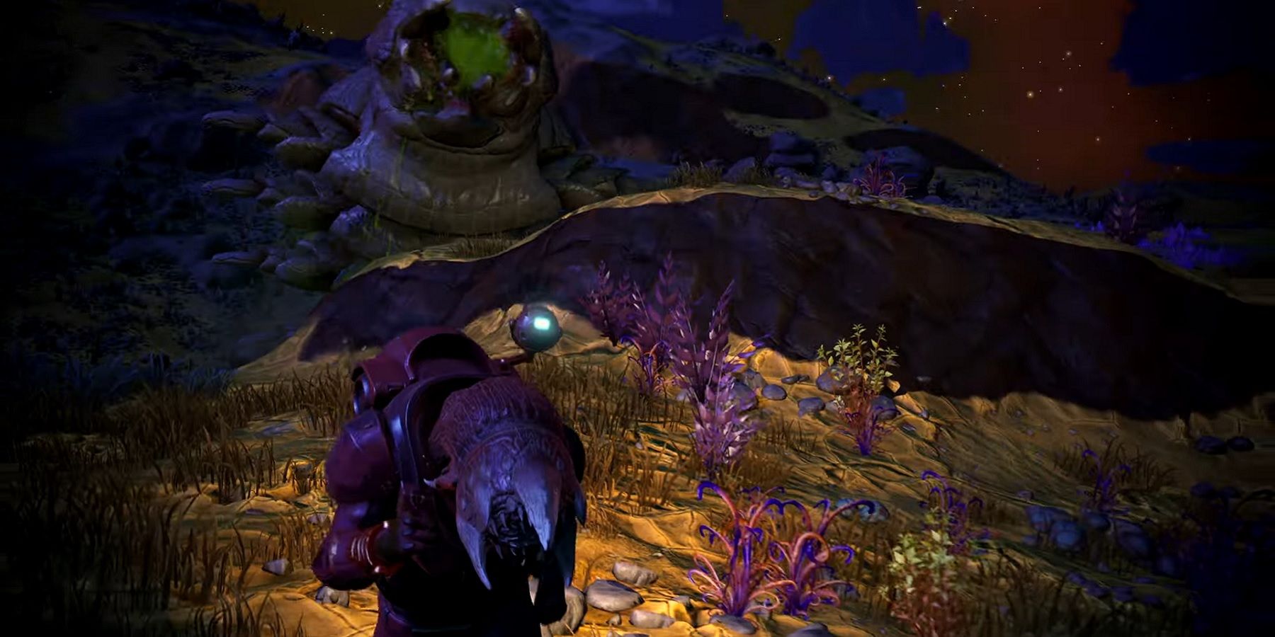 A screenshot from No Man's Sky showing a player running away from an emerging sandworm.