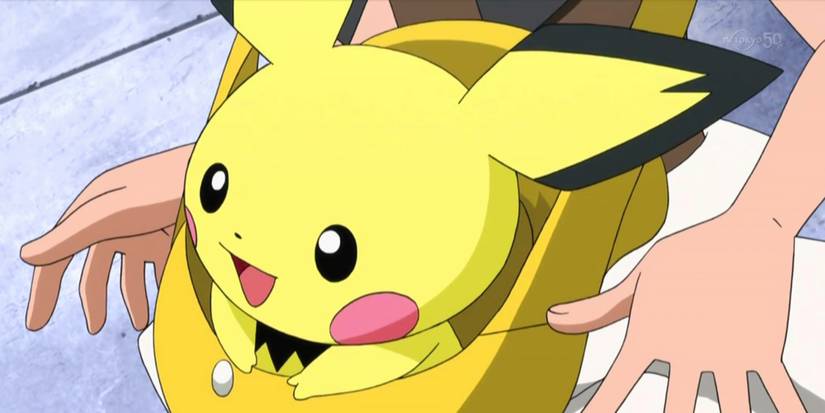 Pichu riding in a bag.