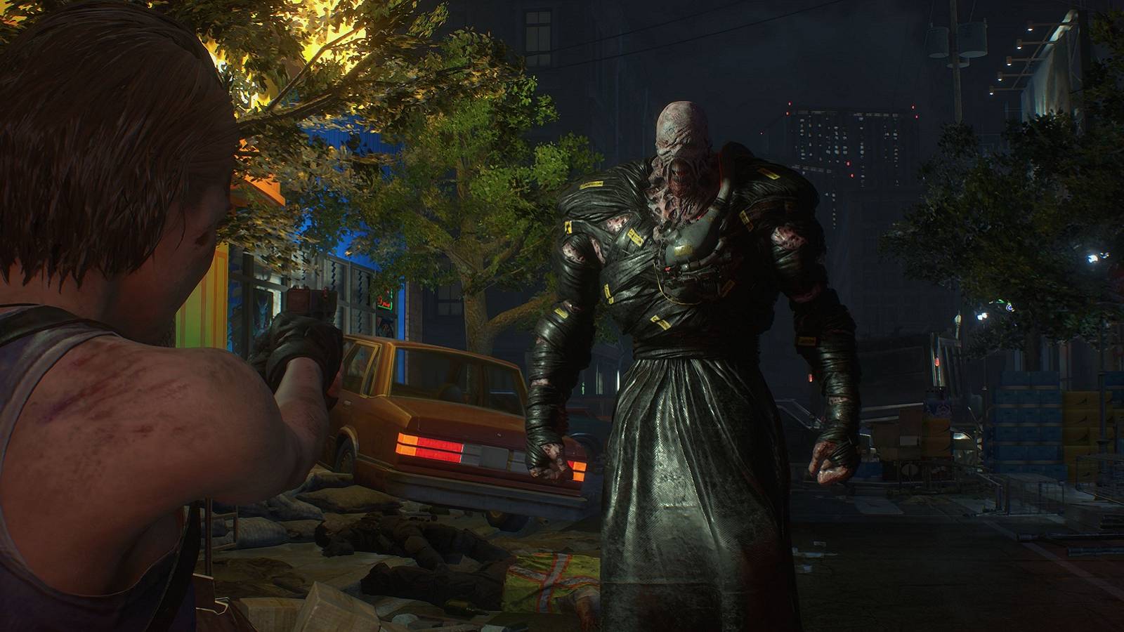 Screenshot from the Resident Evil 3 remake showing Jill about to fire at the approaching Nemesis.