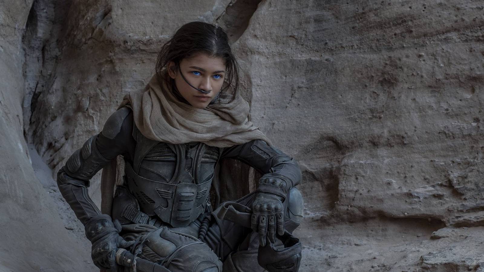 zendaya crouching in desert