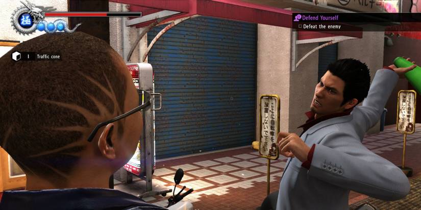 Fighting an enemy in Yakuza