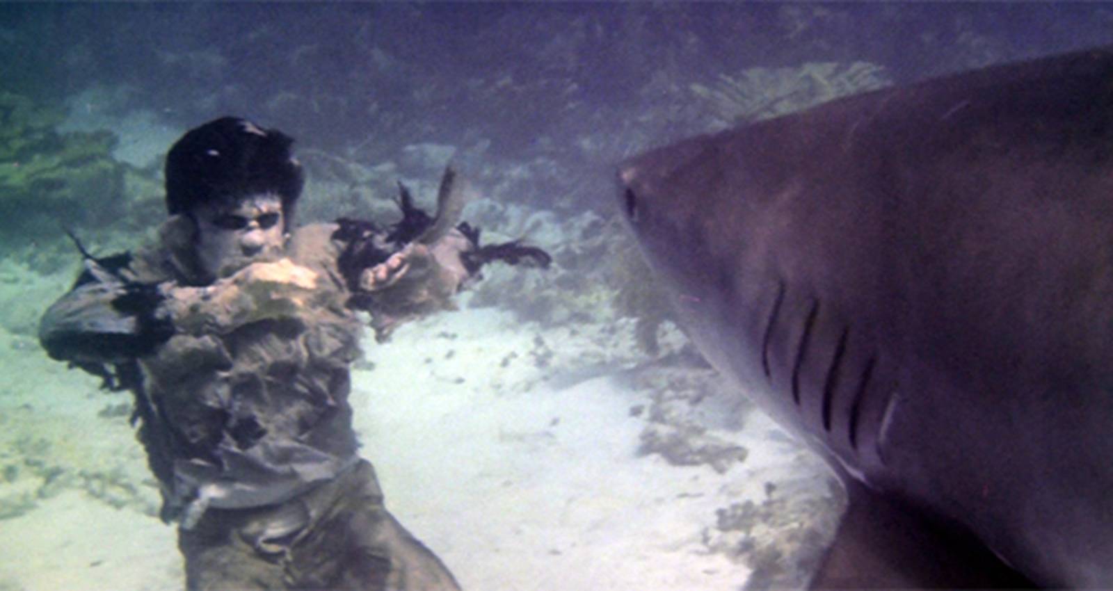 A-zombie-underwater-with-a-shark-in-Zombie-Flesh-Eaters-1