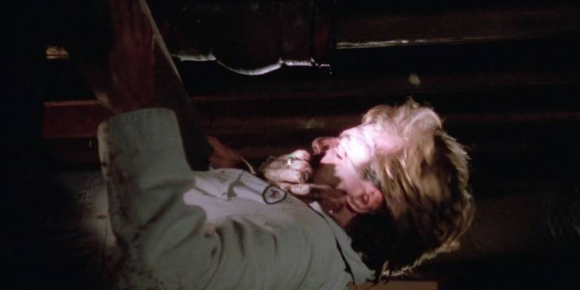 A character getting attacked in Amityville: The Evil Escapes