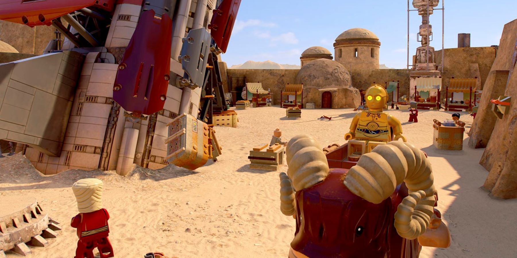 C3PO riding on a Bantha near some spaceship wreckage in Mos Eisley in LEGO Star Wars: The Skywalker Saga
