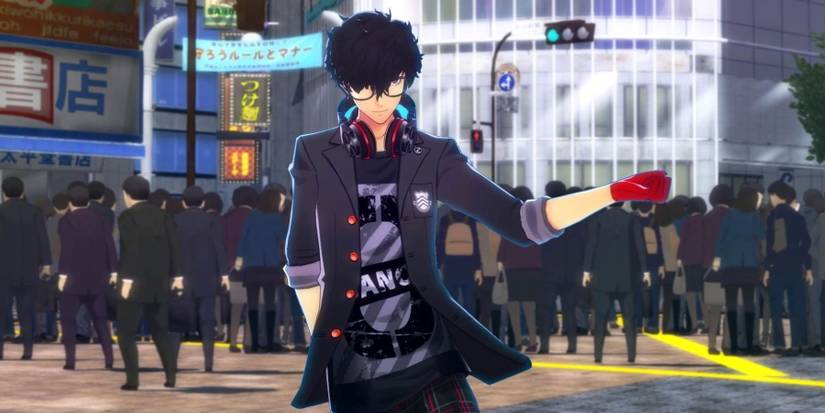 Joker standing in Shibuya and wearing casual clothes under his Shujin uniform in Persona 5: Dancing in Starlight