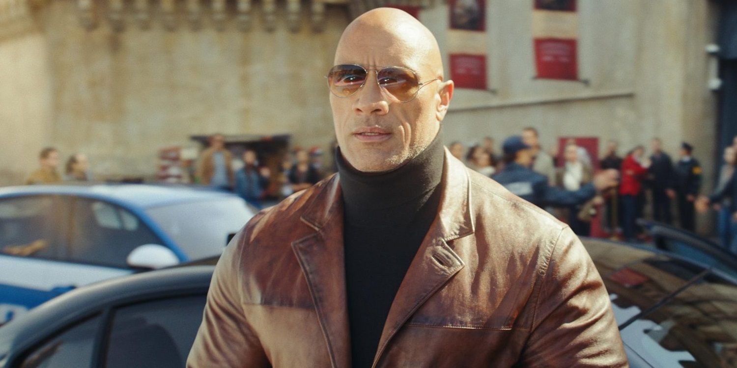 Dwayne Johnson wearing a turtleneck and leather jacket in Netflix's Red Notice