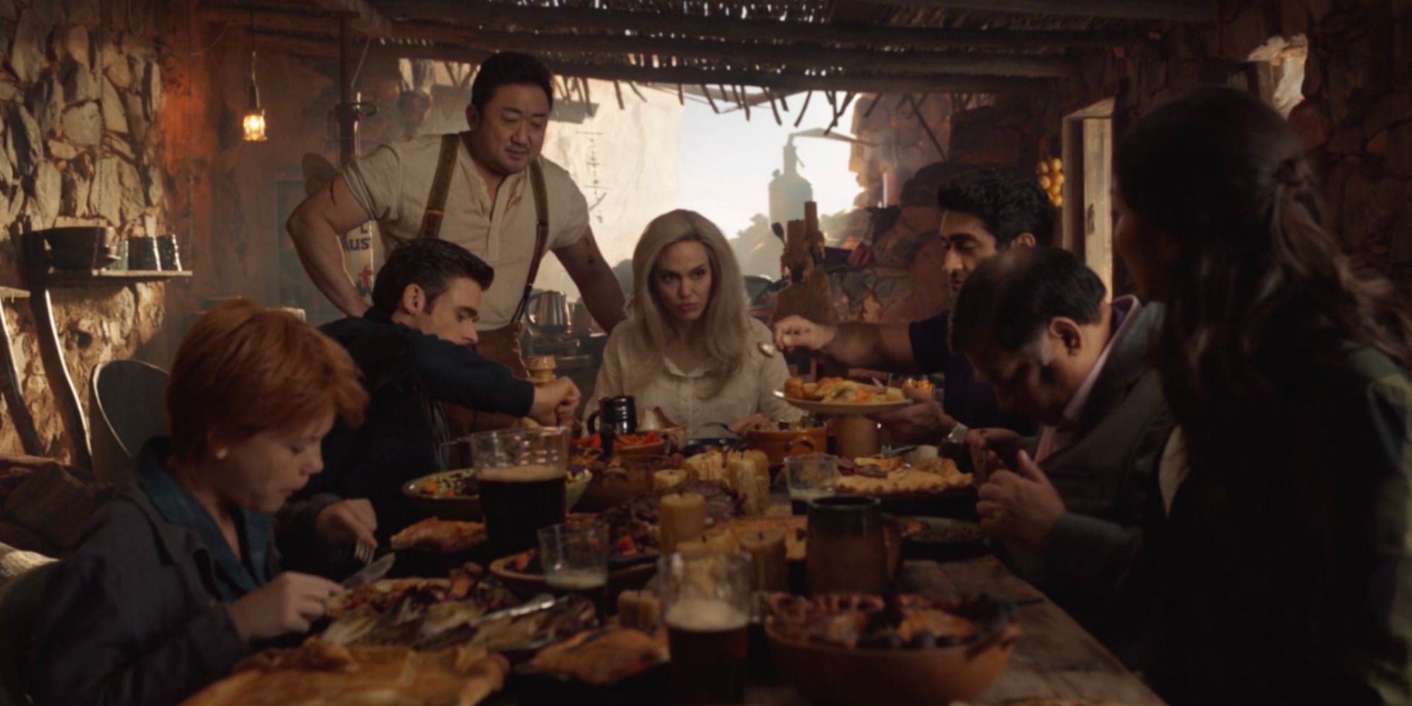 A dinner scene featuring multiple characters from Eternals