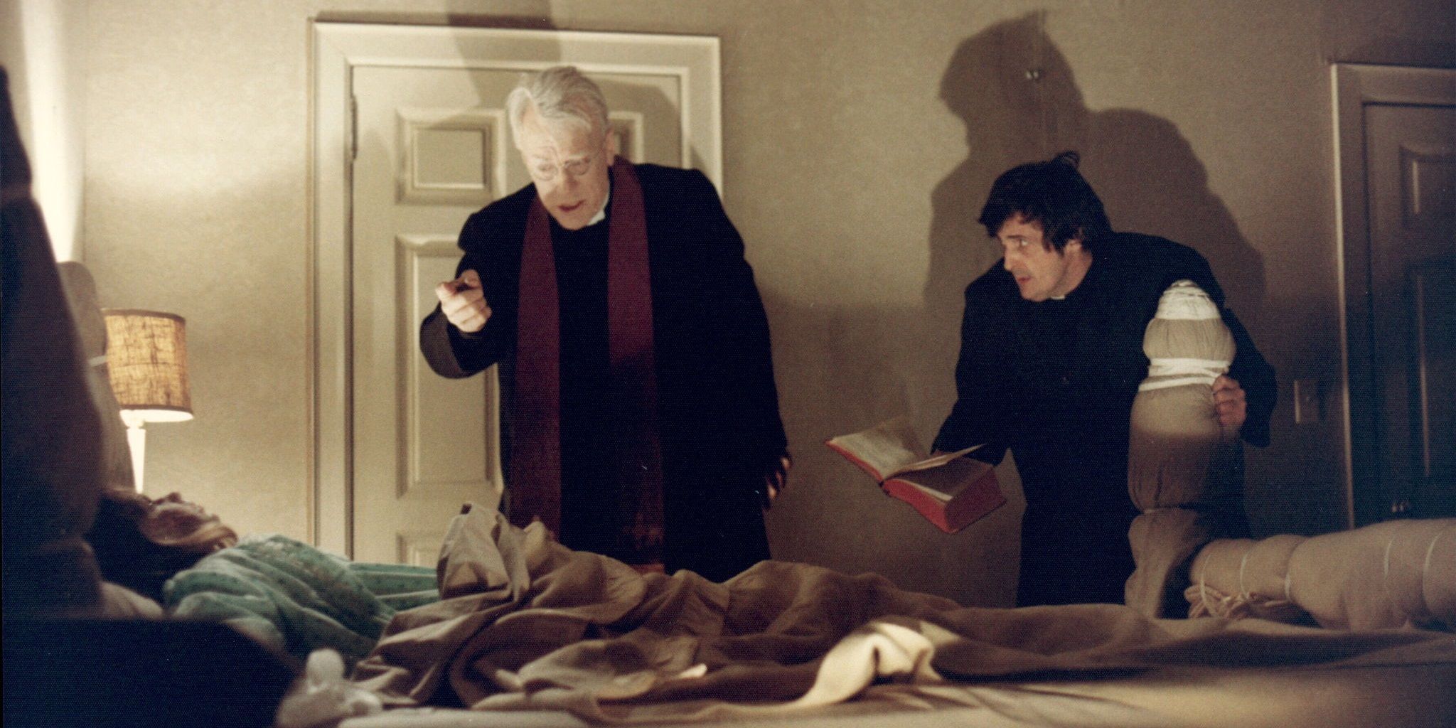 Fathers Merrin and Karras begin the exorcism in The Exorcist
