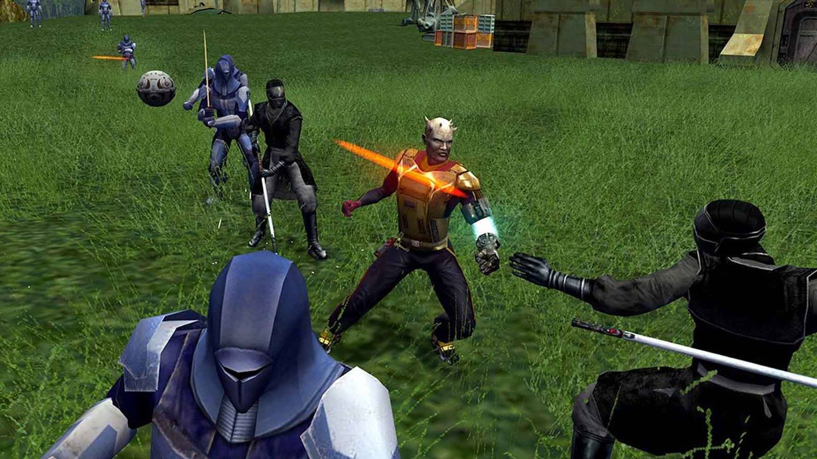 Fighting enemies on a grassy field in KOTOR