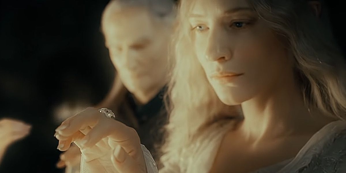 Galadriel holds up and looks at Nenya, her Ring of Power