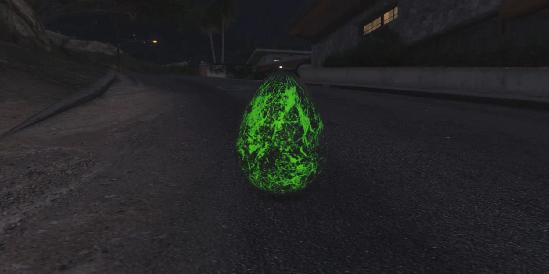 A Green Glowing Alien Egg Sitting on the Side of a Road in GTA Online