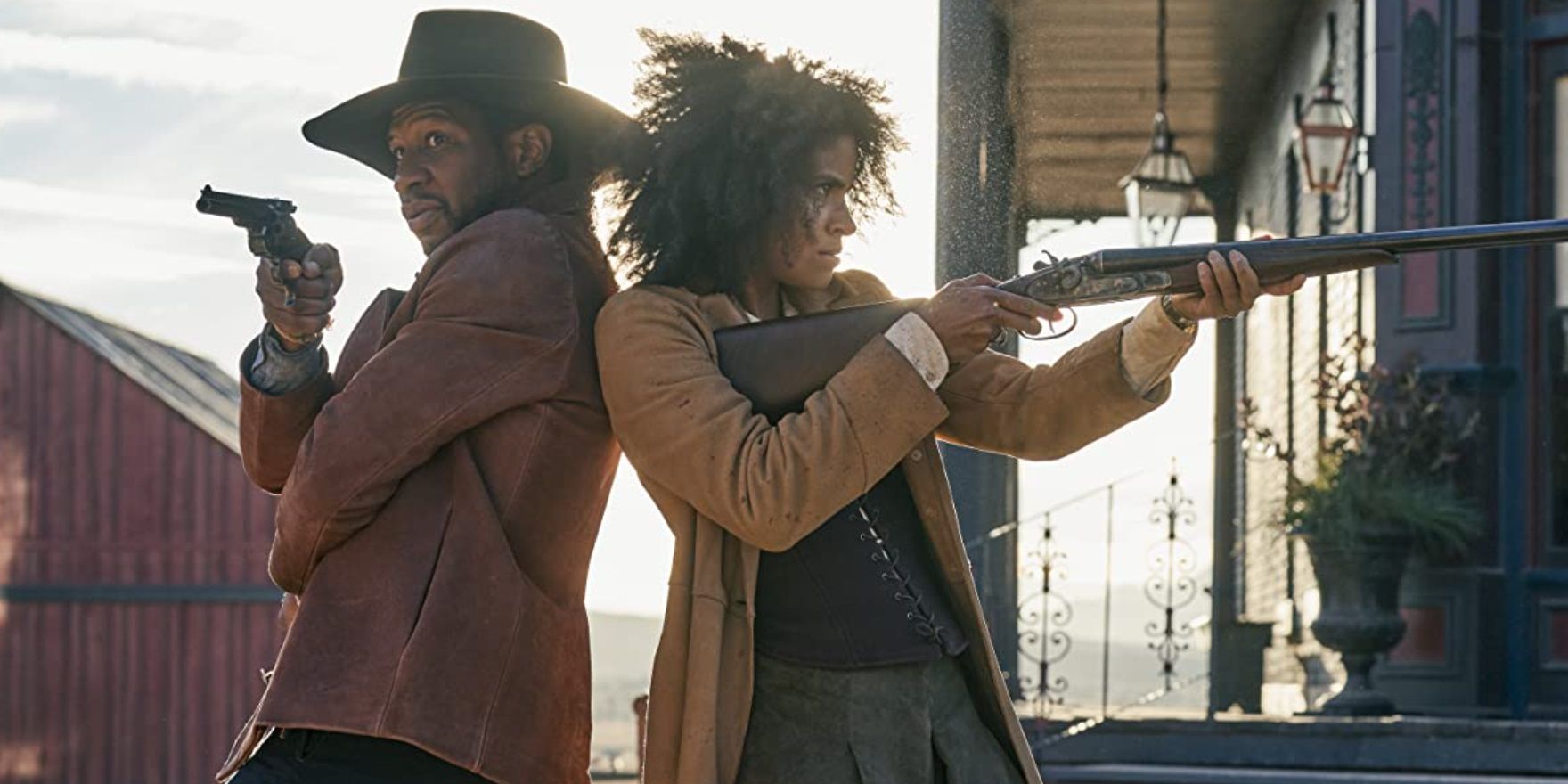 Jonathan Majors and Zazie Beetz shooting back-to-back in The Harder They Fall