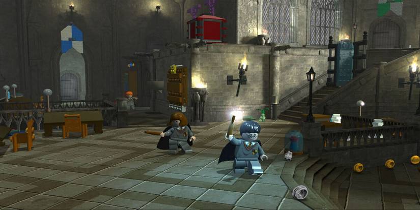 Lego Harry Potter Years 1-4 Great Hall with Harry and Hermione holding wands Gameplay Screenshot