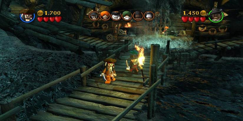 Lego Pirates of the Caribbean The Video Game screenshot Captain Jack Sparrow and Will Turner with swords on wooden bridge