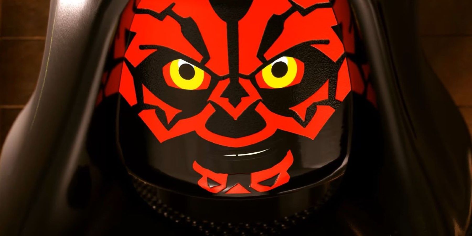 Darth Maul with his hood up smirking at the camera in LEGO Star Wars: The Skywalker Saga