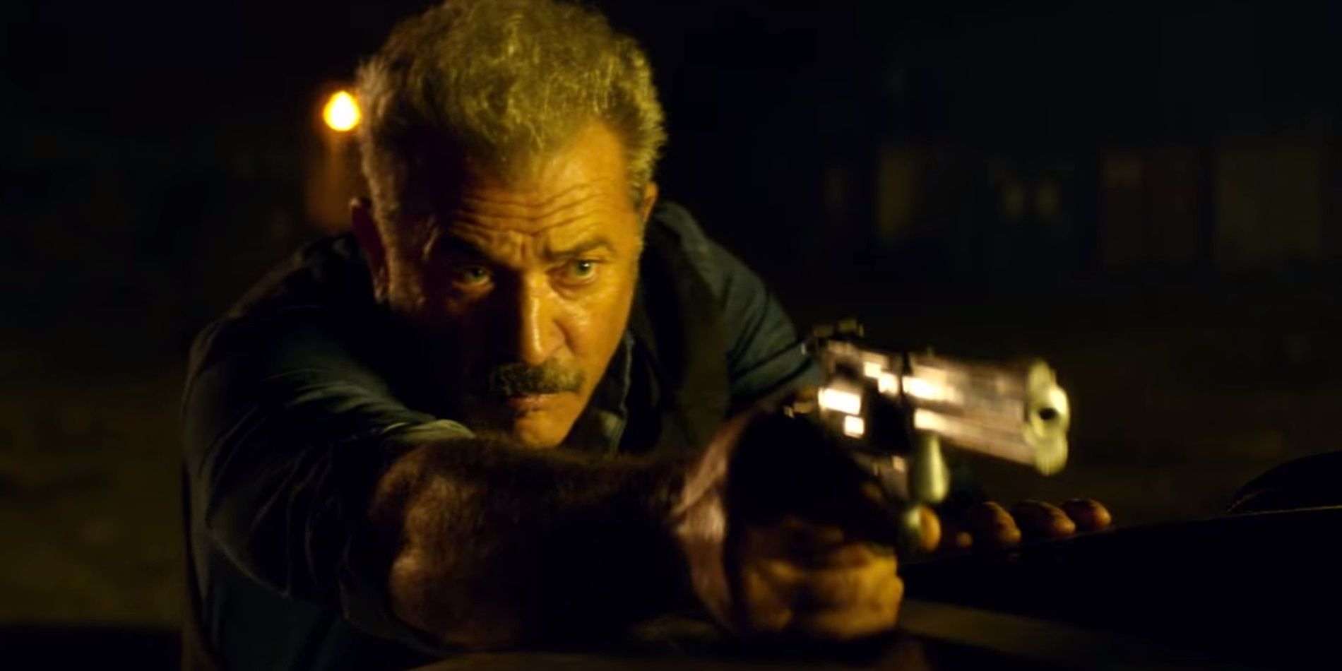 Mel Gibson with a handgun in Dragged Across Concrete