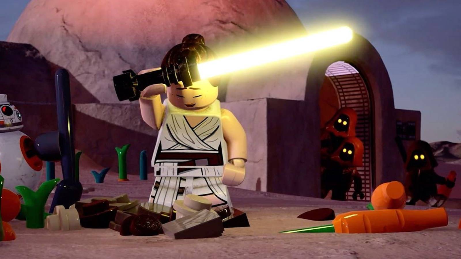 Rey holding a yellow lightsaber and standing in front of a hut on Tatooine while surrounded by BB-8, Jawas, and carrots in LEGO Star Wars: The Skywalker Saga