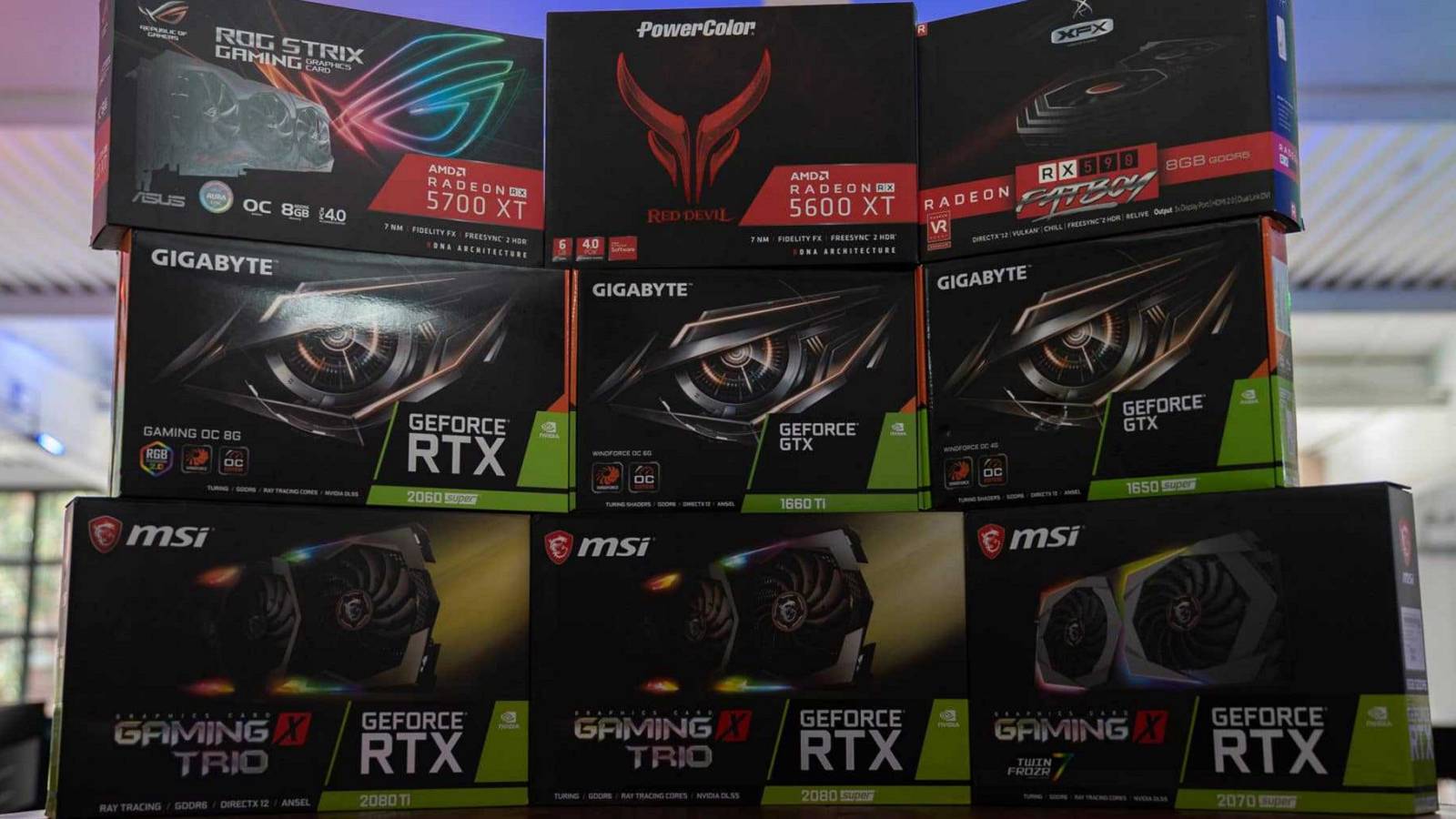 A photo of some AMD and Nvidia graphics card boxes stacked on top of each other.