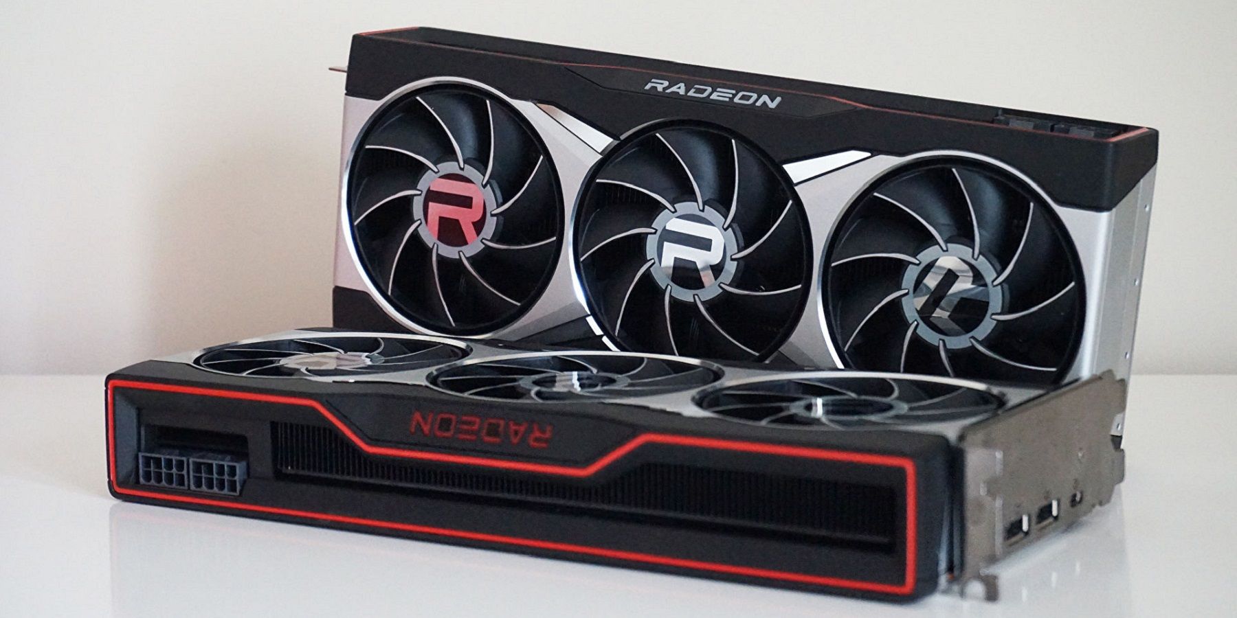 A photo of a couple of AMD Radeon graphics cards on a white background.