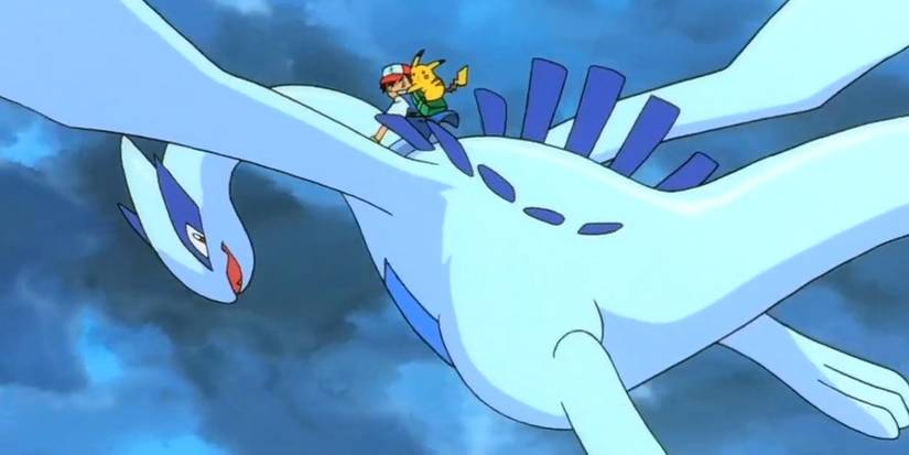 Ash riding Lugia. 