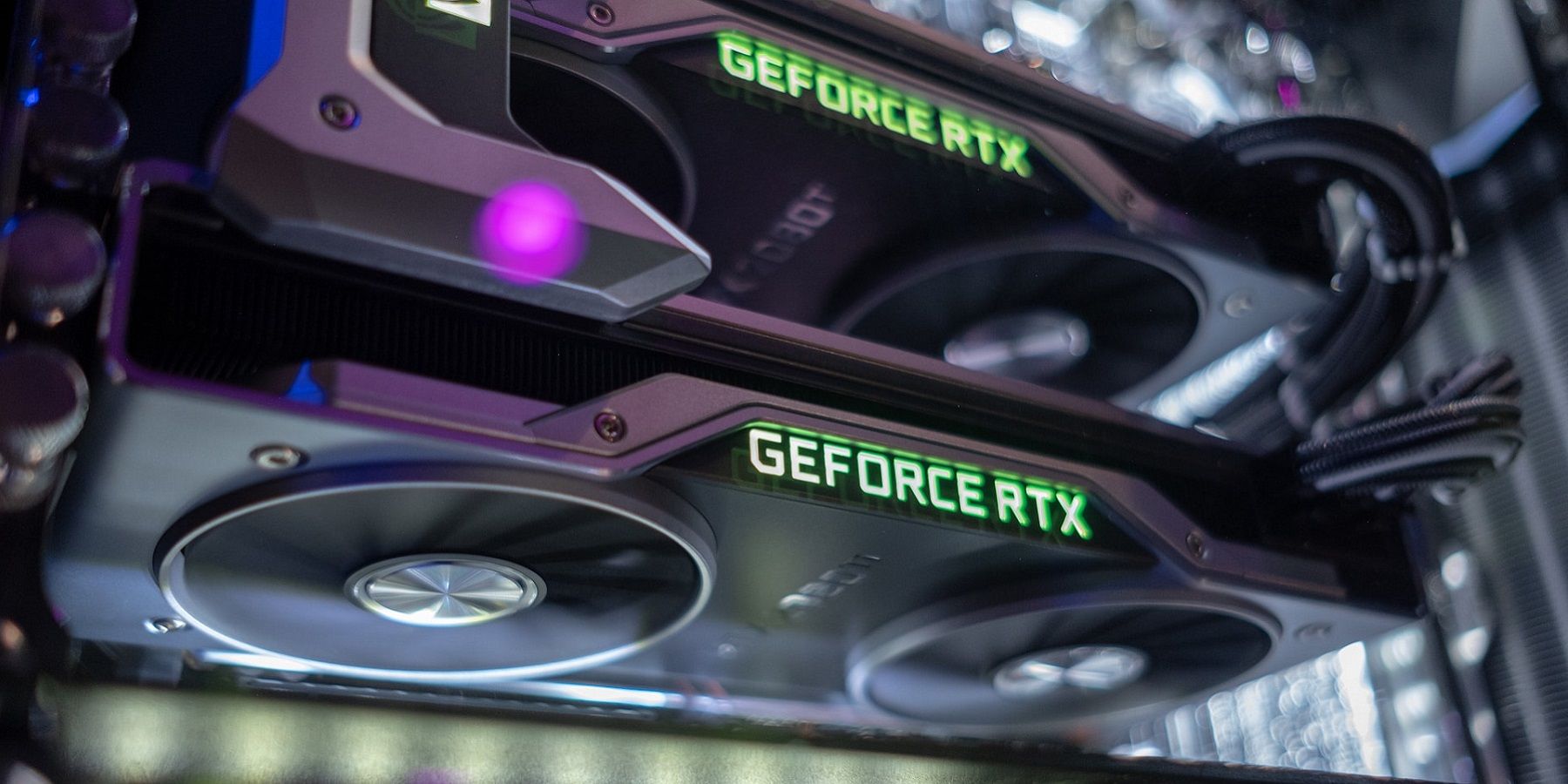 A close-up of a couple of Nvidia RTX graphics cards in a PC.