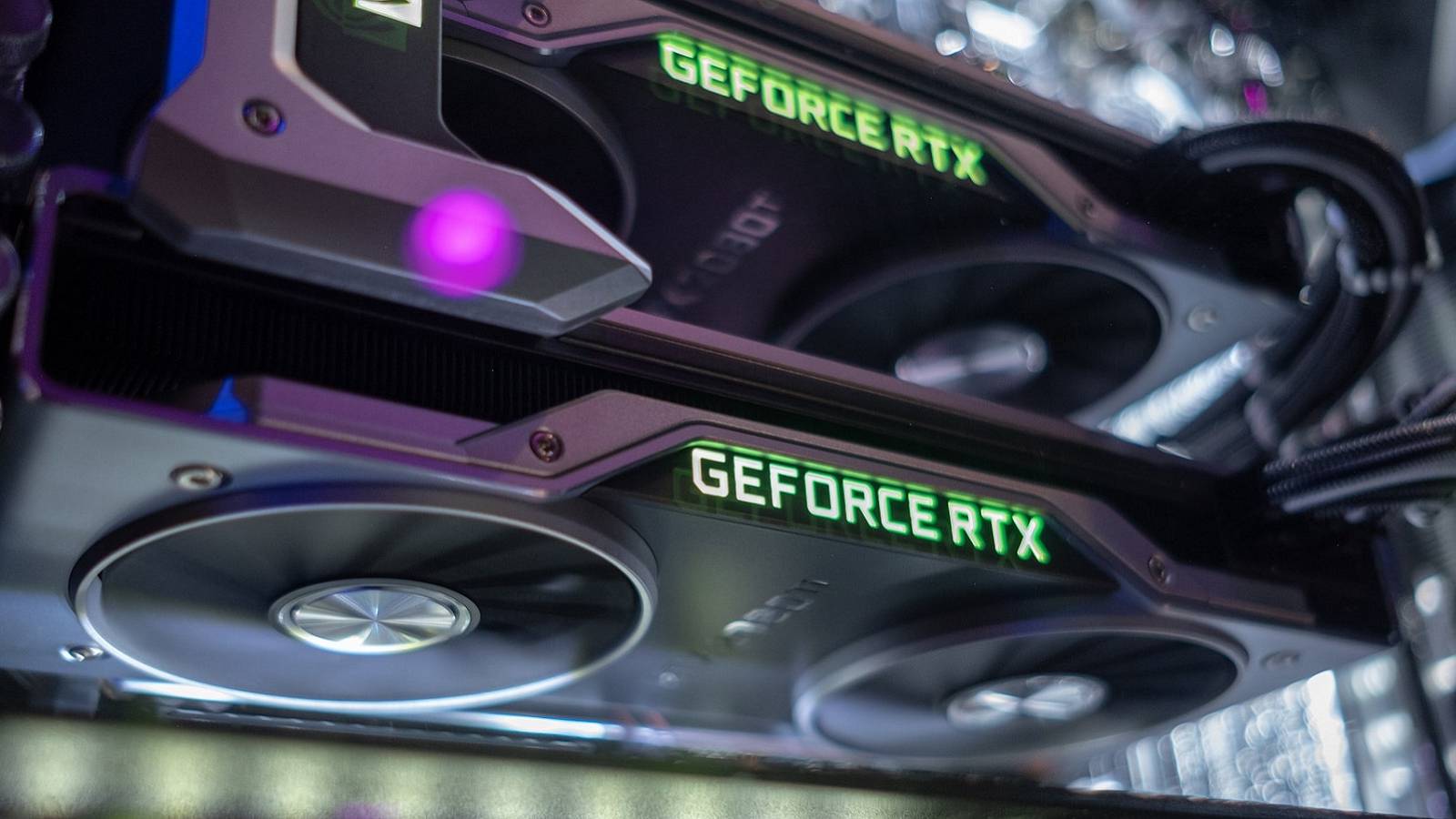 A close-up of a couple of Nvidia RTX graphics cards in a PC.