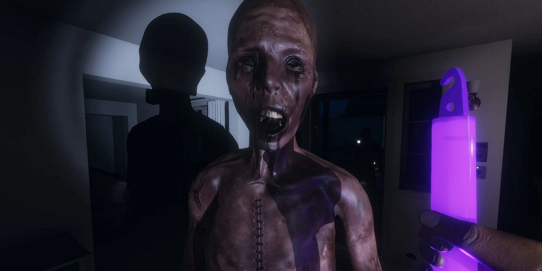 Screenshot from Phasmophobia showing a creepy looking being right up close to the player.