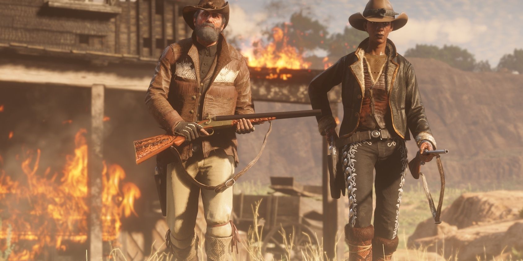 red dead online players walking away from a house on fire 