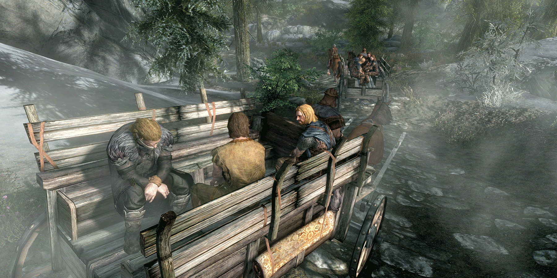 Screenshot from The Elder Scrolls 5: Skyrim showing the opening cart ride cutscene from a different angle.