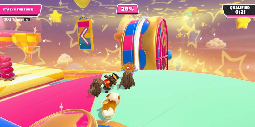 a group of fall guy beans standing on a platform with a giant, industrial fan next to it