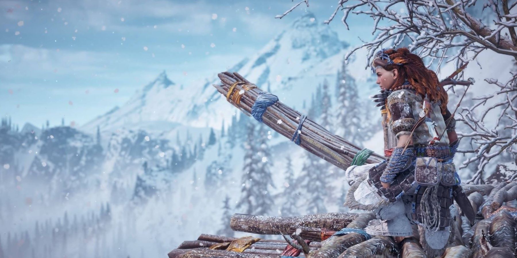 Aloy wearing Banuk armor and crouching in the Frozen Wilds in Horizon Zero Dawn