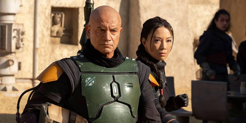 Boba and Fennec walk through a Tatooine town in The Book of Boba Fett