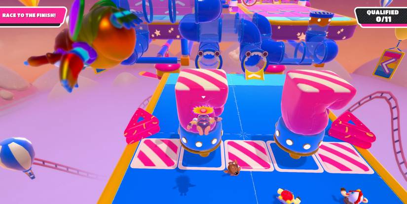 a fall guy bean in a flower hat dives toward a pink and white fist trap shooting up out of the floor