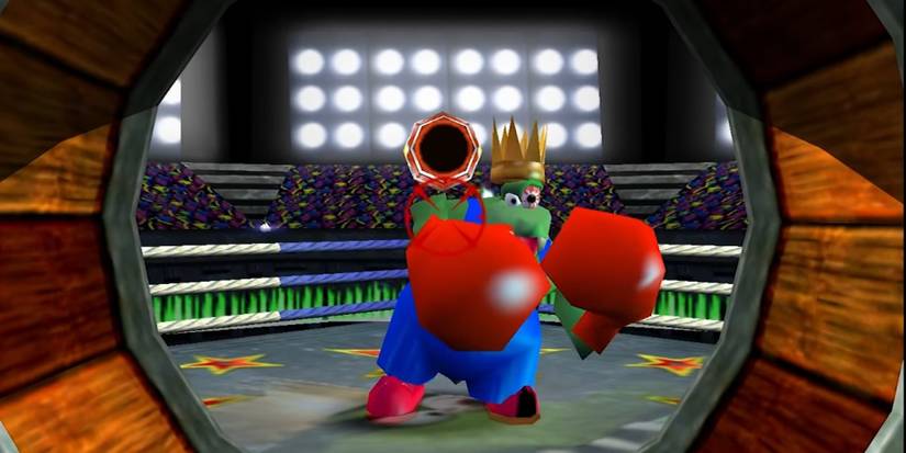Donkey Kong 64 boss looking through barrel at boxing K Rool