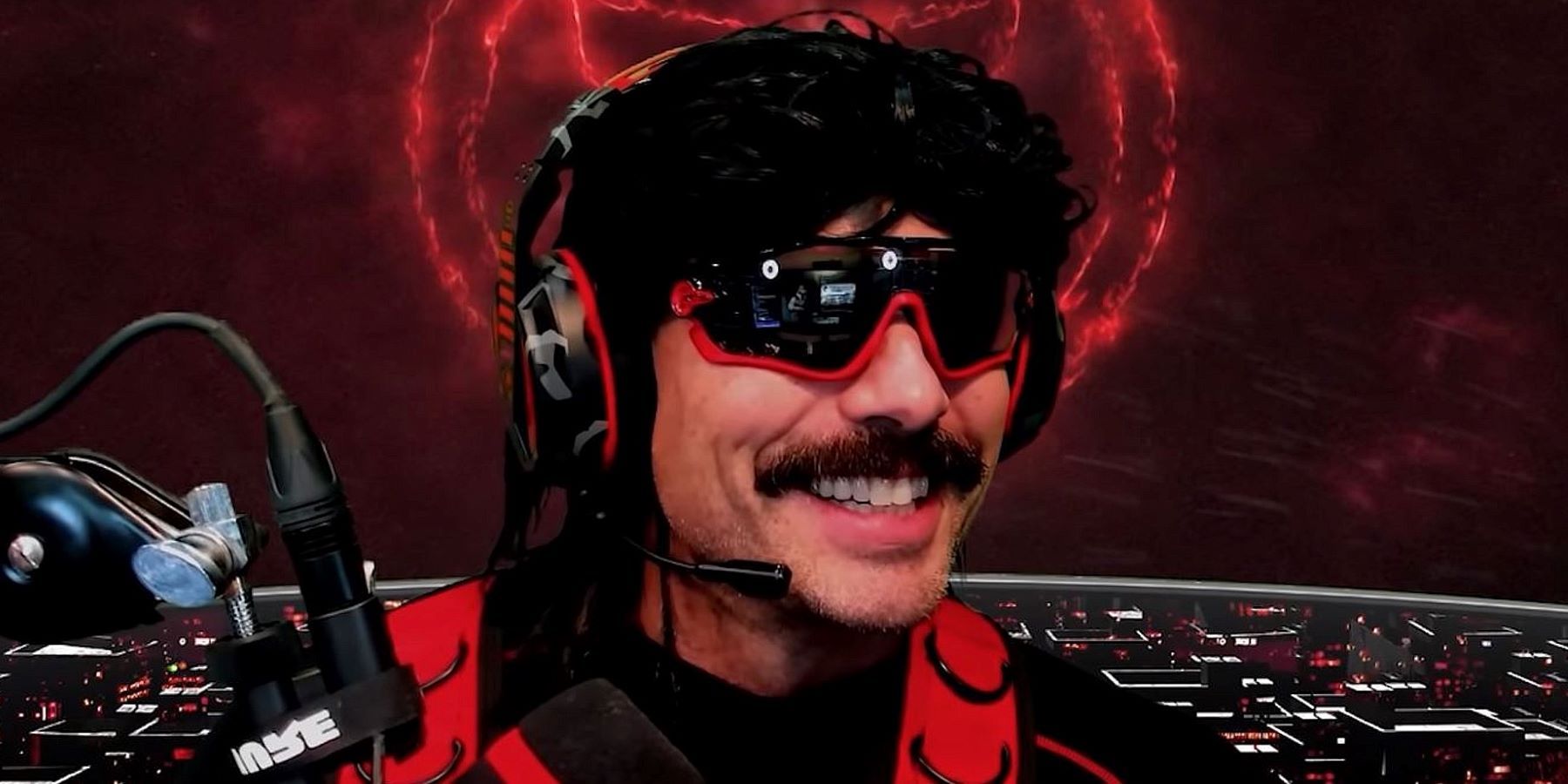 Dr Disrespect grinning and looking offscreen during a YouTube Gaming live stream