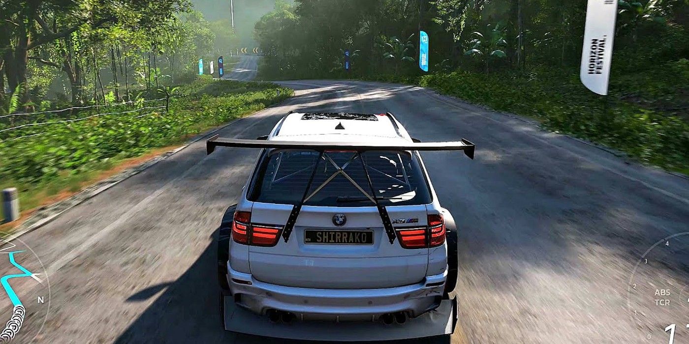 Forza Horizon 5 BMW X5M Forza Edition with fin driving on forest road with flags