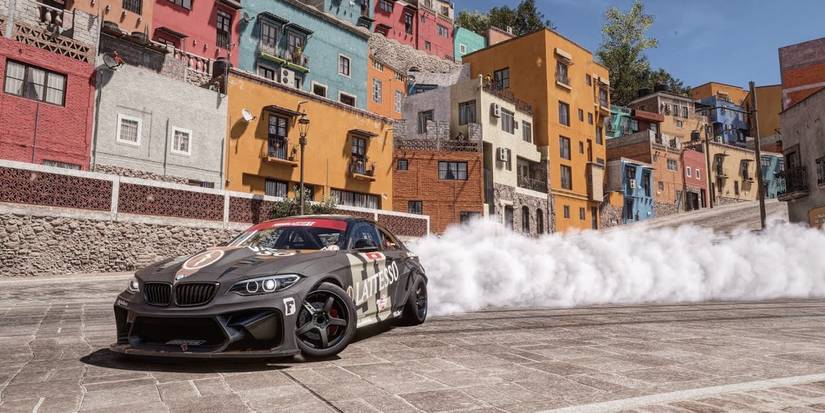 Forza Horizon 5 Formula Drift #91 BMW M2 skidding around turn on downhill town street