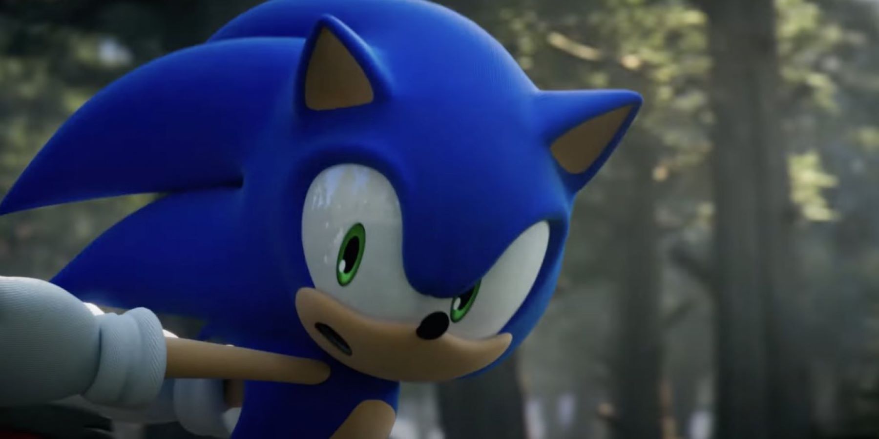 Sonic running through a forest and looking over his shoulders in a Sonic Frontiers trailer