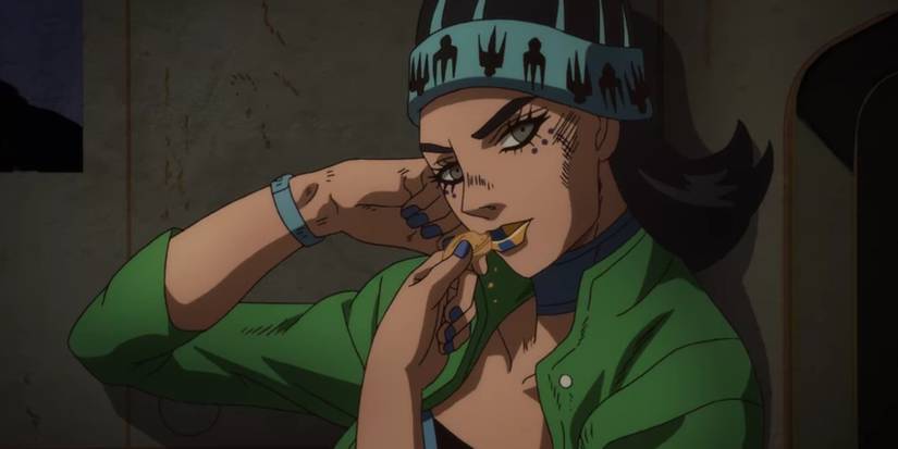 Gwess eating a cookie in her cell