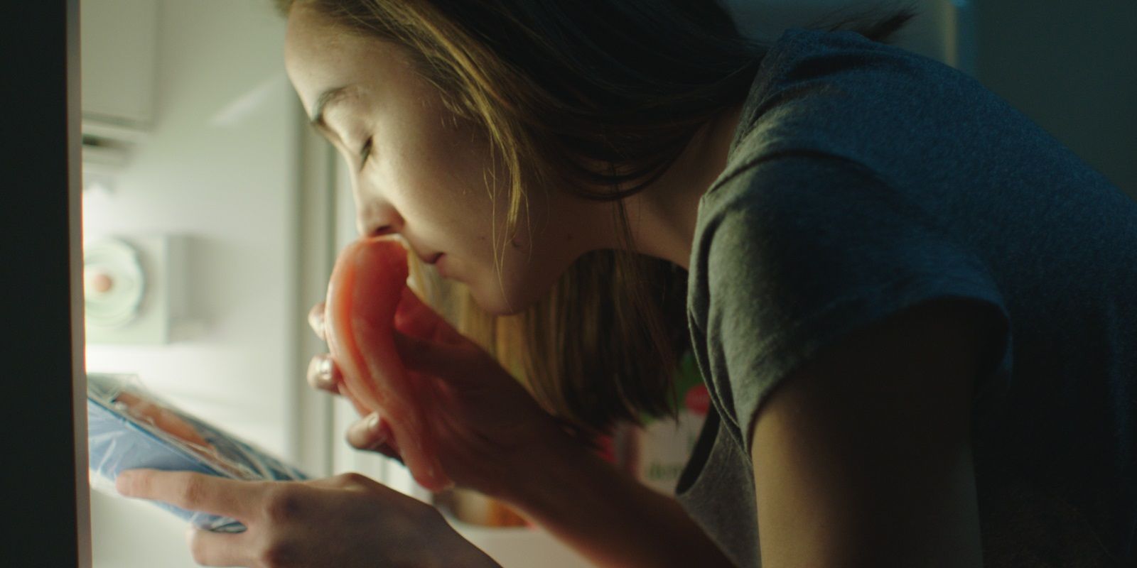 Justine smells chicken in the fridge in Raw