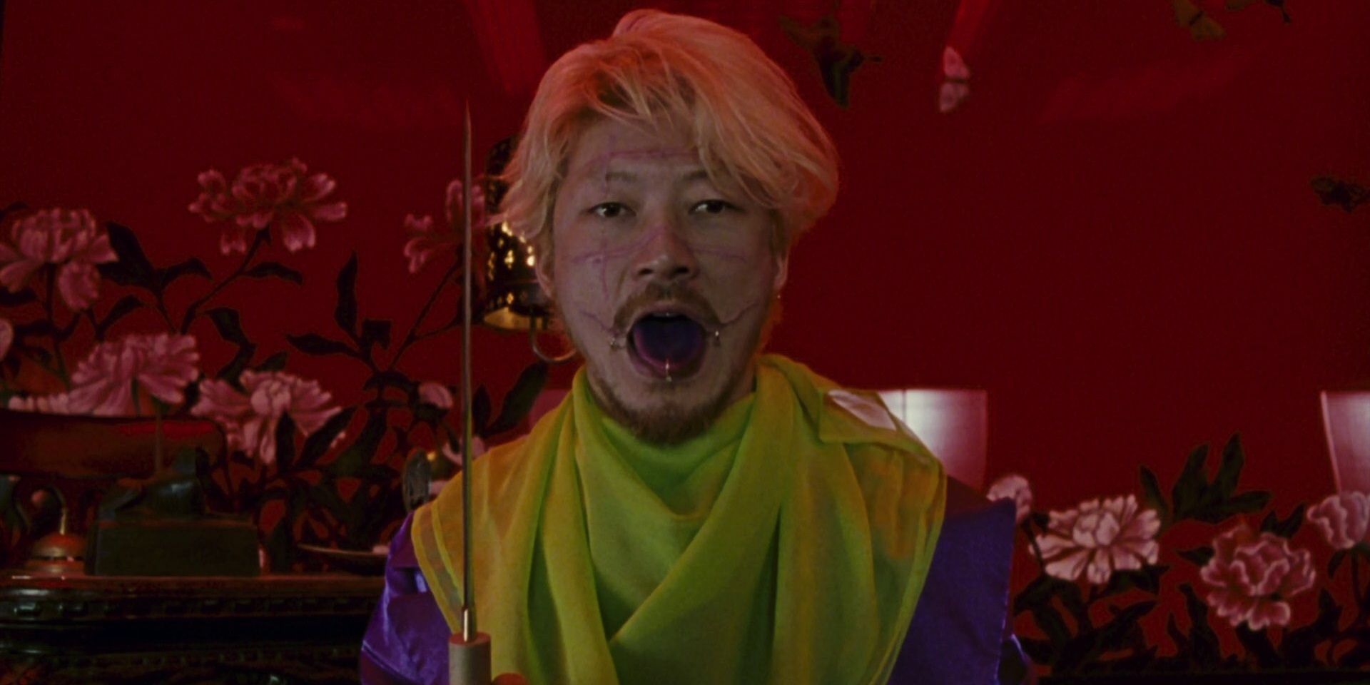 Kakihara holding a knife in Ichi the Killer