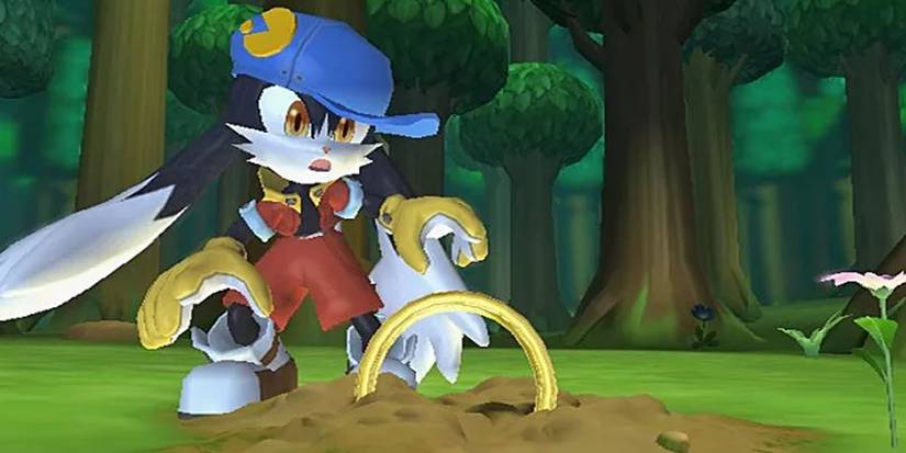 Klonoa character picking up a ring out of the ground